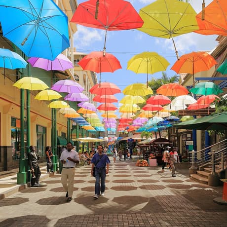 Coloured umbrellas over the Caudan waterfront in Port Louis